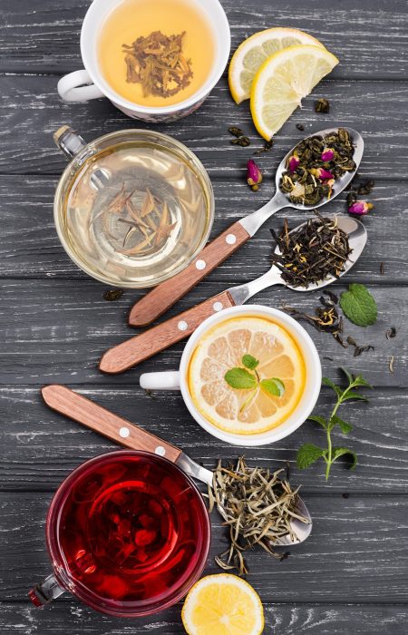 cup-with-tea-herbs-beside